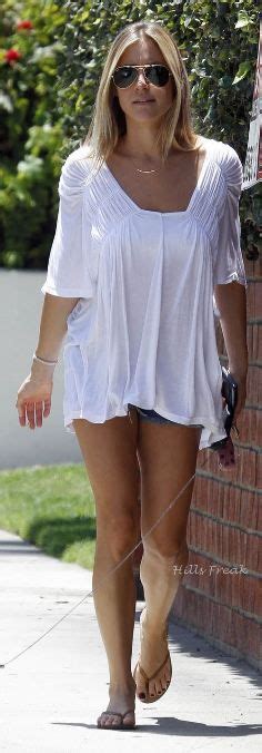 Who Made Kristin Cavallaris Aviator Sunglasses Denim Shorts And