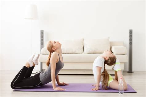 Mother And Daughter Doing Yoga Together Stock Image Image Of