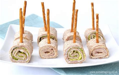 Kids like to be entertained, and what better way to entertain them than by having them help cook! Party Food Idea - Tortilla Roll-up Lollipops