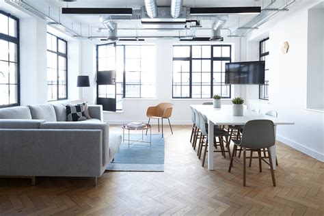 With plants growning on panoramic windows, concrete floor and workplace with interior of loft design studio office with concrete walls and floor, big table with blue chairs, white bookshelves. Free Images : floor, home, ceiling, loft, office, kitchen ...