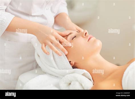 Beautician Makes Facial Massage To The Girl Stock Photo Alamy