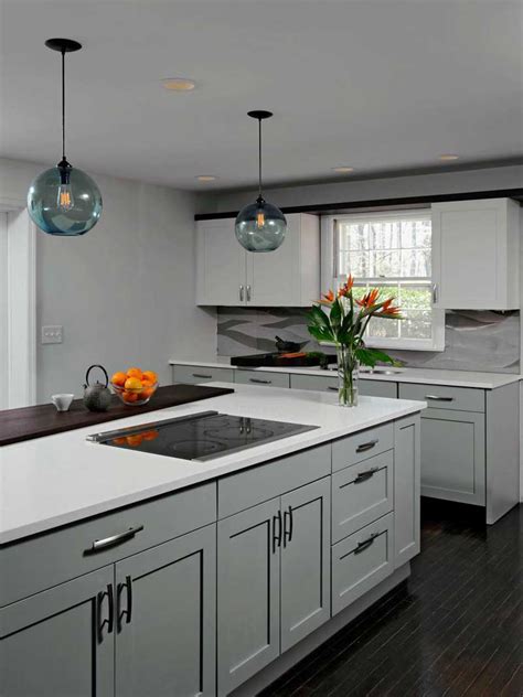 This kitchen island is equipped with 2 deep drawers, a sliding door cabinet with an adjustable shelf, and 2 towel bars. 50 Gorgeous Kitchen Island Design Ideas - Homeluf.com