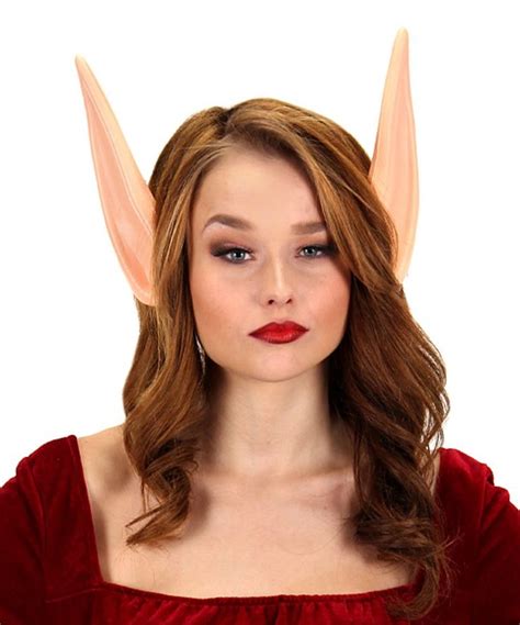 A Woman In A Red Dress With Horns On Her Head