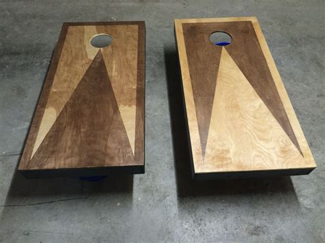 Two Pieces Of Wood Sitting Next To Each Other