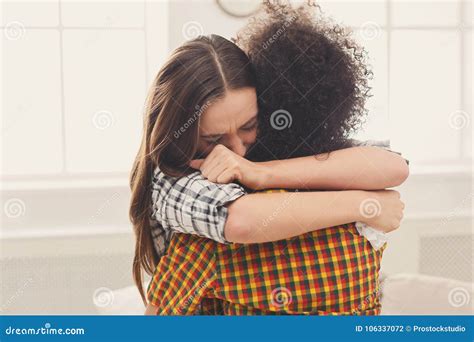 Woman Hugging Her Depressed Friend At Home Stock Photo Image Of