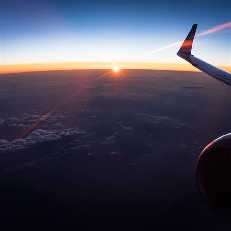 2932x2932 Aerial View Of White Clouds During Sunset Outside Airplane