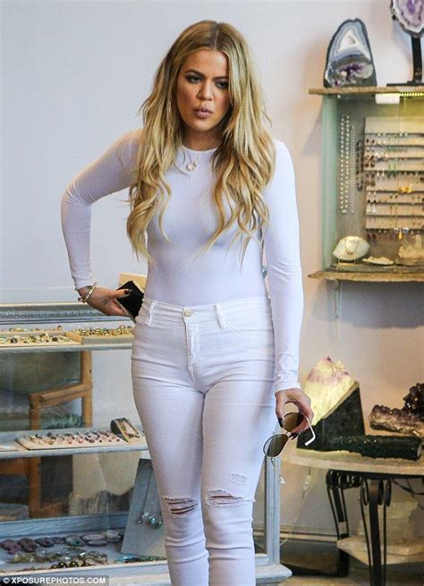 khloe kardashian shops for crystals in skin tight bodysuit and jeans shops beauty and crystals