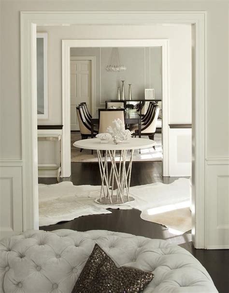 Round Center Of Foyer Table With White Cowhide Rugs Transitional