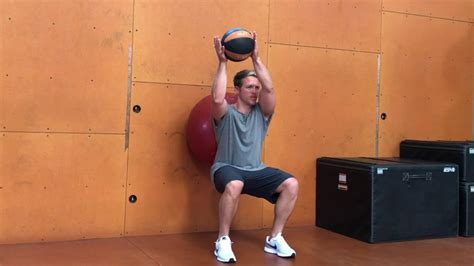 Stability Ball Wall Squat With Medicine Ball Diagonal Raise Youtube