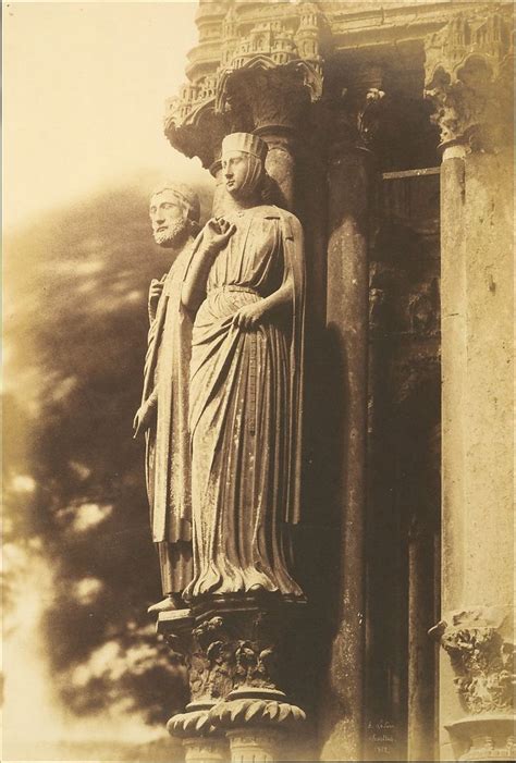 An Old Black And White Photo Of A Statue