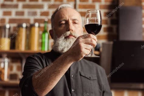 Netizens are trolling controversial shiva stickers of instagram. Man holding wine glass — Stock Photo © ArturVerkhovetskiy #139875670