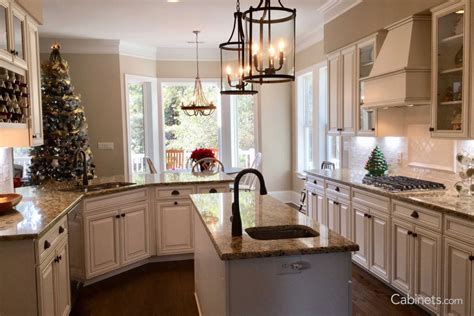 We are using delta's trinisic line in the champagne bronze finish for the shower head/handle, sink faucet and towel bars/toilet paper holder. Bright White Kitchen with Bronze Hardware and Lantern ...