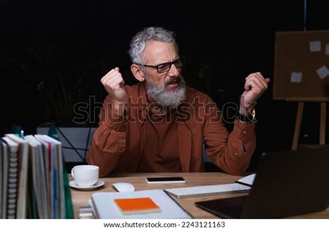 Irritated Businessman Holding Clenched Fists During Stock Photo