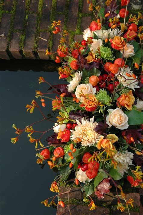 More intricate floral tributes will cost more money. What a beautiful arrangement of fall colors, These reminde ...