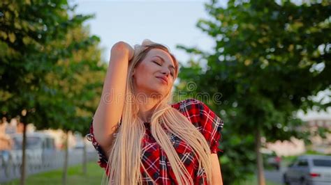 Portrait Pretty Blonde Girl Straightens Her Long Hair And Cute Smiling
