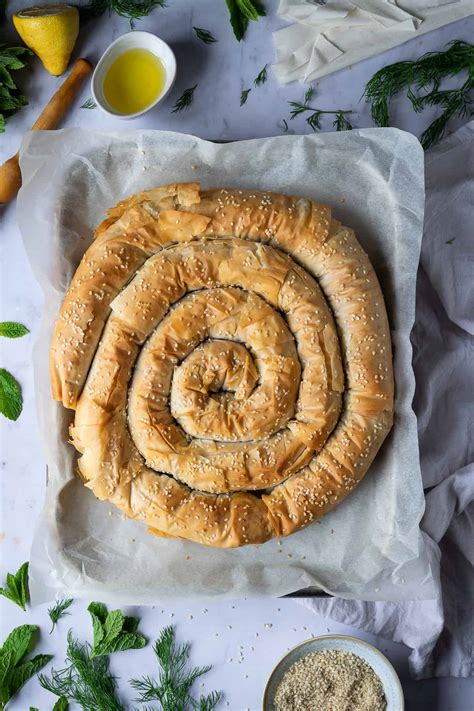 There is actually a traditional vegan version of spanakopita that is served during lent (the christian fast before easter) which just uses the spinach, onions and herbs but no eggs and cheese. Vegan Spanakopita Spiral - Domestic Gothess