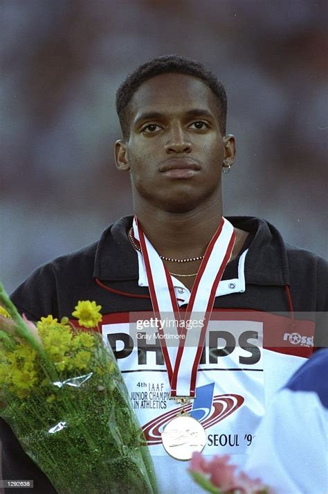 Ato Boldon Of Trinidad Stands On The Podium After Receiving One Of