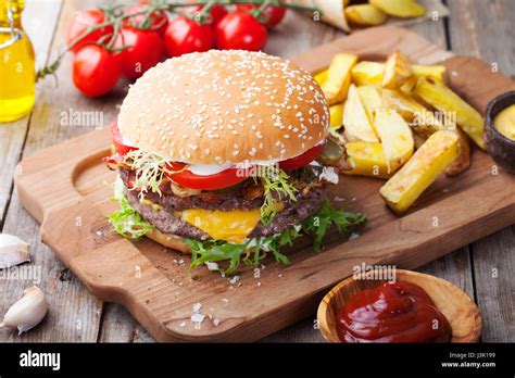 Burger Hamburger With French Fries Ketchup Mustard And Fresh