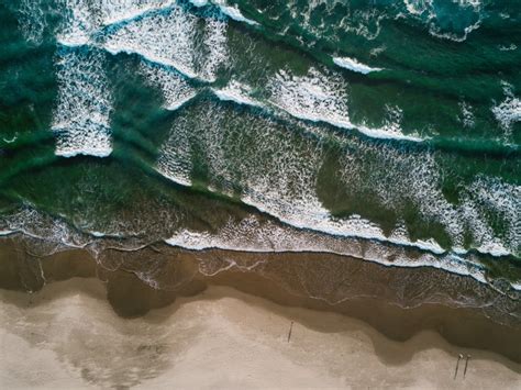 🔥 Download Ocean Aerial Surf Waves Shore Sand Foam Stock Photos By