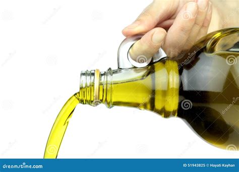 Pouring Extra Virgin Olive Oil From Glass Bottle On White Background