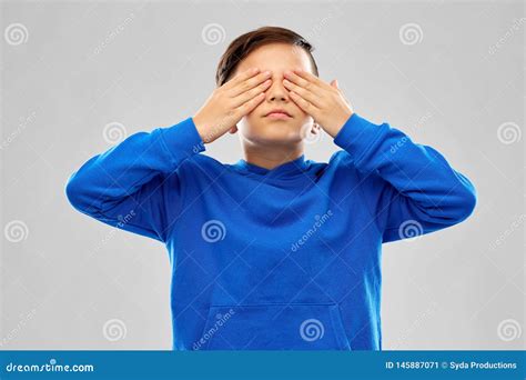 Boy In Blue Hoodie Closing His Eyes By Hands Stock Image Image Of
