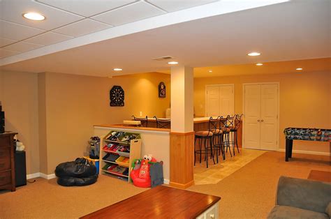 Clear out the room and sweep the concrete basement floor so the carpet squares will stick properly. Awesome finished basement/ rec room | Rec room, Rec room ...