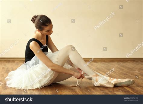 Ballerina Warming Pointes On Wooden Floor Stock Photo 355741577