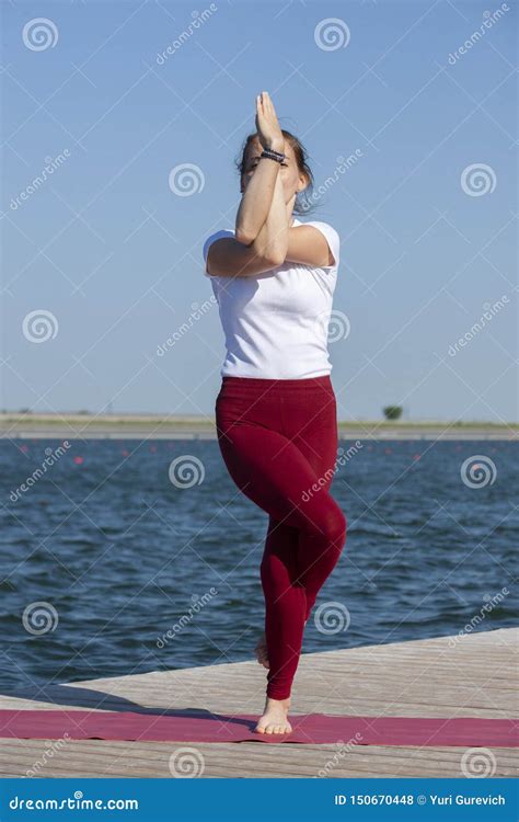 Pretty Woman Practicing Yoga At A Lake Stock Photo Image Of Pose