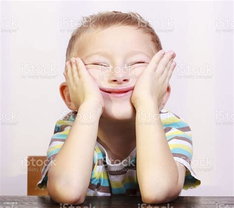 Portrait Of Blond Boy Child Kid Making Funny Face Stock Photo