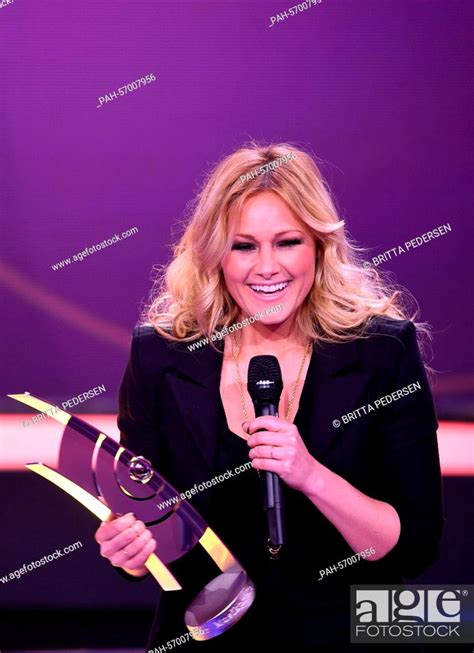 Singer Helene Fischer Stands On Stage With Her Award During Echo Music Awards Ceremony In Berlin