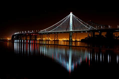 Illuminated Suspension Bridge Against Sky At Night · Free Stock Photo