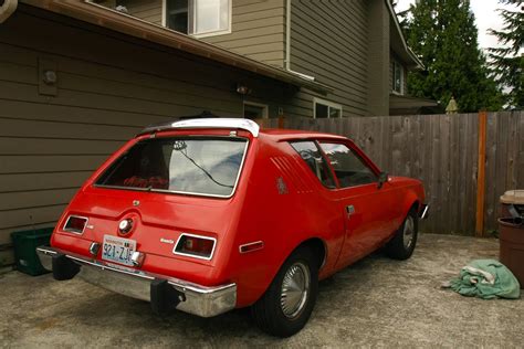During its manufacturing run from april 1, 1970 through 1978, a total of 671. OLD PARKED CARS.: 1976 AMC Gremlin.