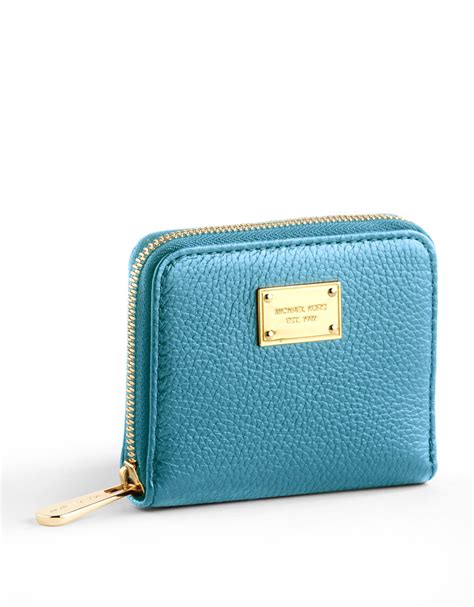 Made to hold all of your essentials, our leather women's wristlet wallets come in a variety of colors and patterns—all ideal to carry on their own or keep in your everyday handbag. Lyst - Michael Michael Kors Small Zip Around Leather ...