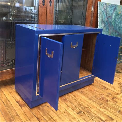 Campaign furniture which is designed to be 'folded up' and carried long distances has been a feature of travelling armies over many centuries. Cobalt Blue Campaign Bar Cabinet | Chairish