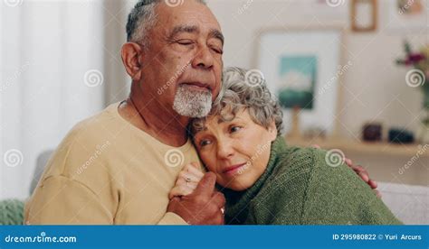 Love Hug And Senior Couple With Empathy And Comfort Or Security On Home Sofa Elderly Man And