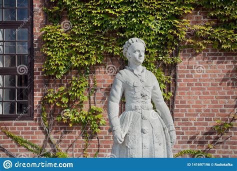 Danish Woman Statue In Traditional Costume Street In