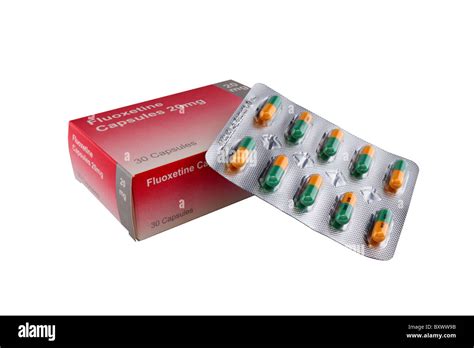 una caja de 20 mg de fluoxetina capsulas con una hoja de cápsulas de la caja fotografía de stock