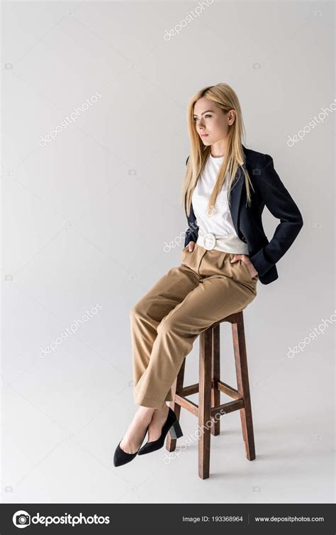 Full Length View Beautiful Stylish Blonde Girl Sitting Chair Looking