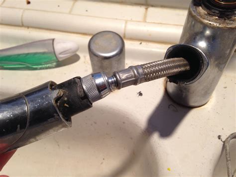 Slide the basin wrench to one of the nuts supporting the faucet base to the sink. plumbing - How to tighten this kitchen sink faucet? - Home ...