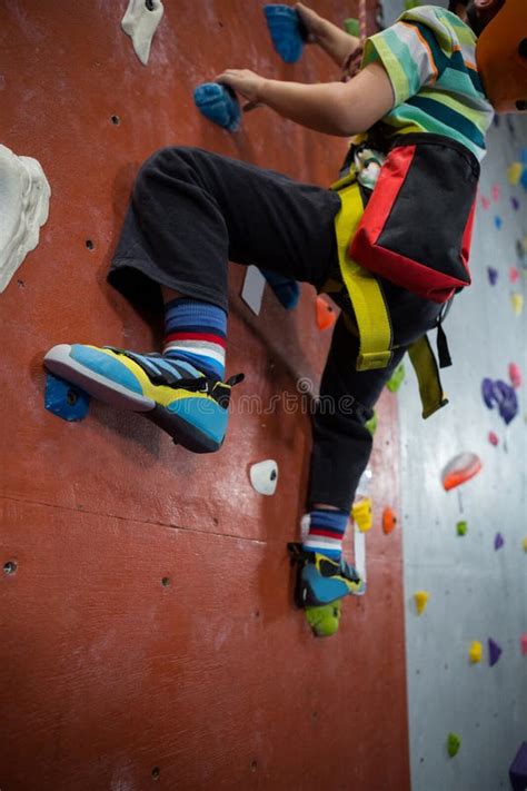 Boy Practicing Rock Climbing In Fitness Studio Stock Photo Image Of