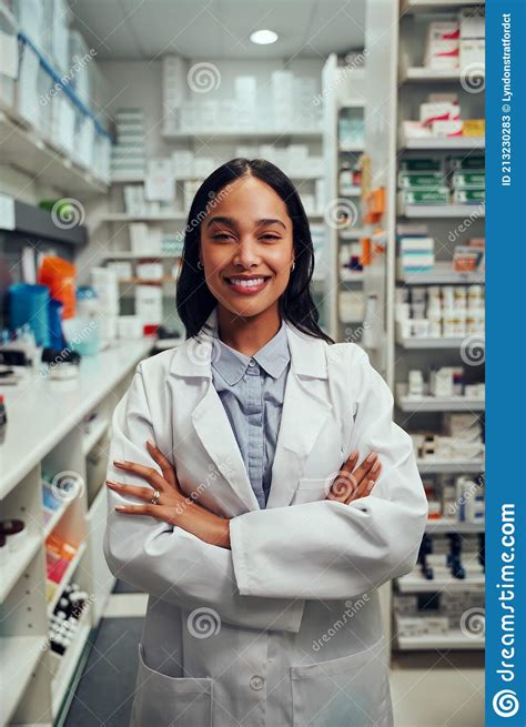 Portrait Of Smiling Young African American Woman Pharmacist Wearing