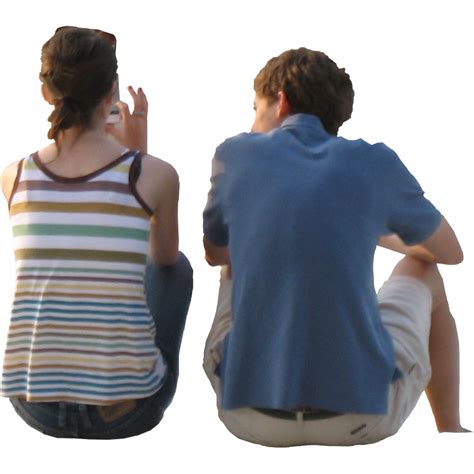 Two People Sitting On The Ground And One Is Holding His Hand Up In The Air