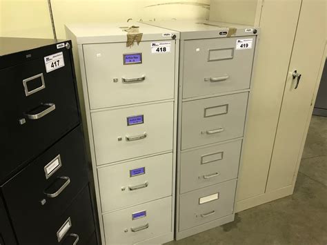 Maybe you would like to learn more about one of these? GREY 4 DRAWER LEGAL SIZE VERTICAL FILE CABINET - Able Auctions