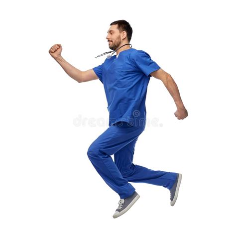 Happy Smiling Doctor Or Male Nurse Jumping In Air Stock Photo Image