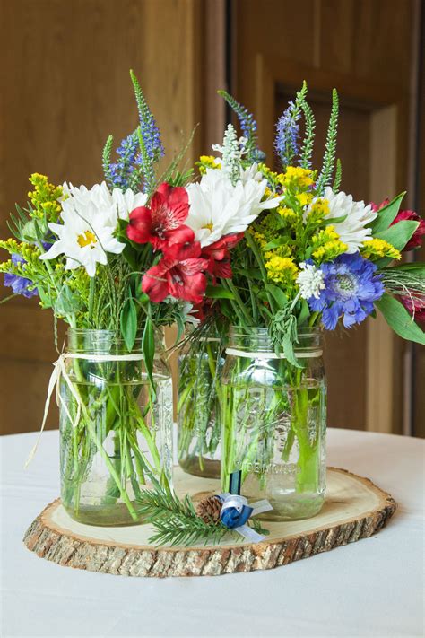 Red, White, Blue and Yellow Wildflower Centerpieces | Wildflower centerpieces, Blue centerpieces ...