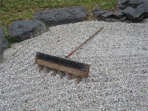 Using the steel garden rake, rake out uneven spots. Beech Zen Rake :: Buy Zen...