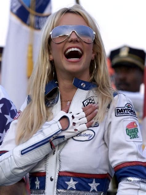 Entertainer Britney Spears Reacts To A Military Flyover As She Listens