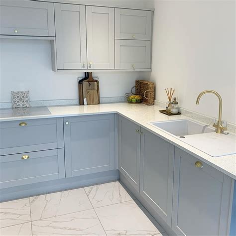 White painted cabinets give your kitchen a clean, airy look, but they can turn yellow with time. Allendale Dove Grey Kitchen | Modern grey kitchen, Tiny ...