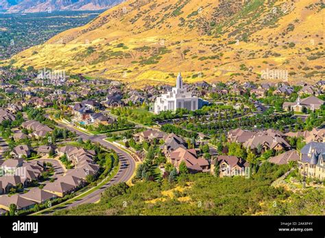 Salt Lake City Utah Suburbs With A White Temple Towering Over Houses