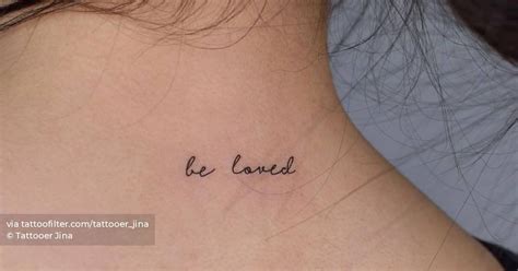 Be Loved Lettering Tattoo On The Upper Back